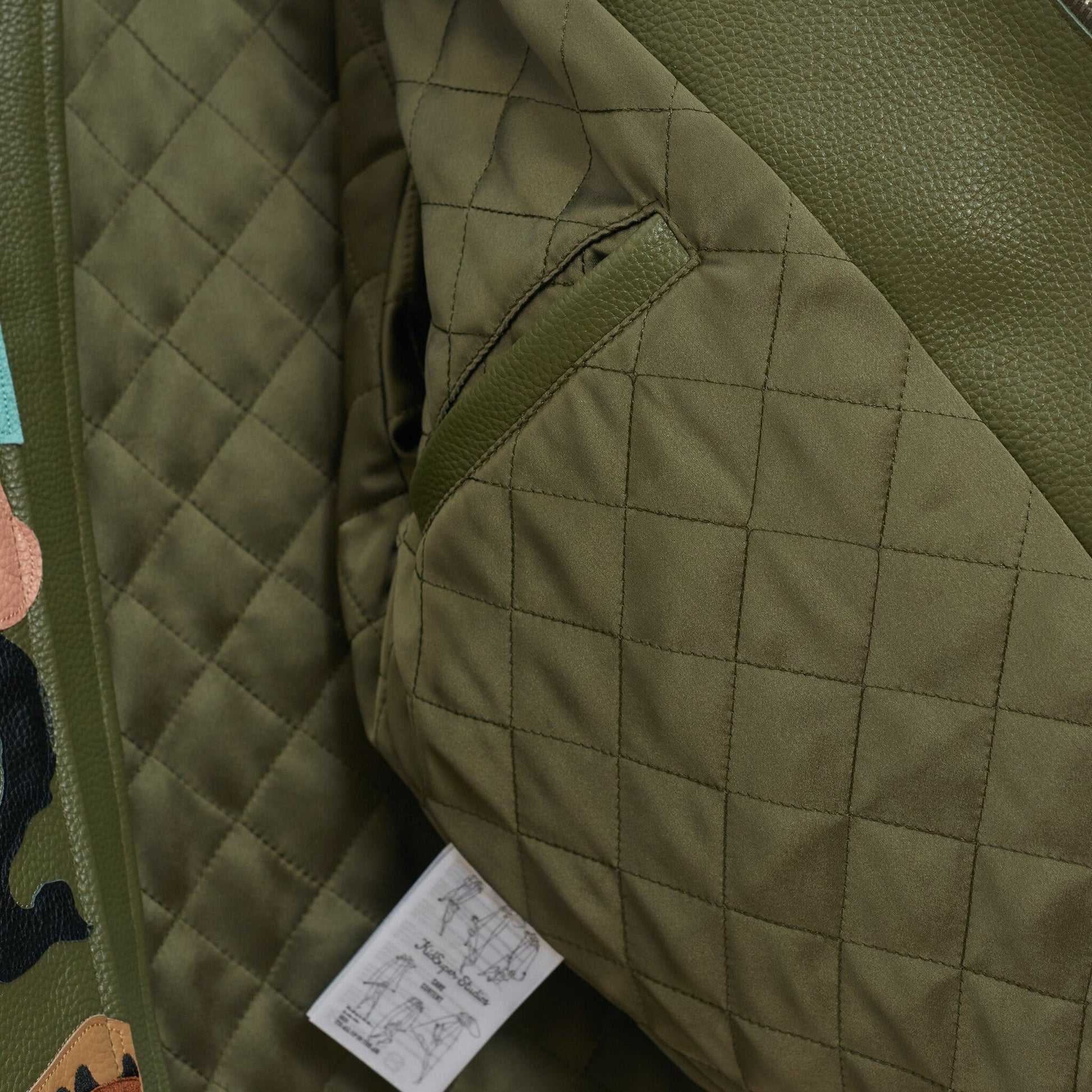 Kidsuper Patchwork Face Leather Varsity Jacket